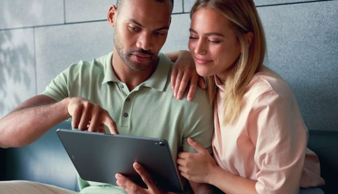 Couple looking at something on a tablet